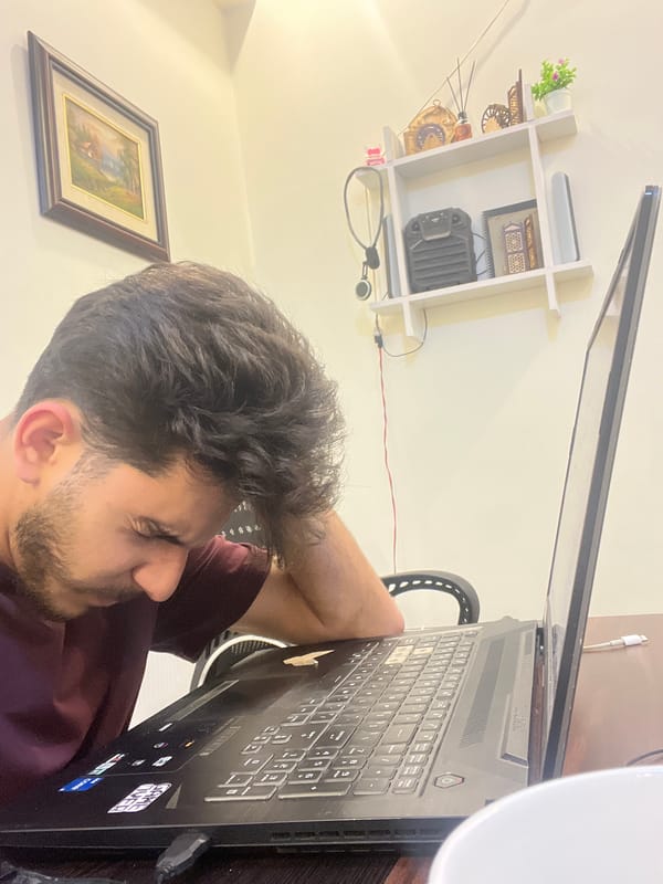 Young man records video content with laptop in Damascus