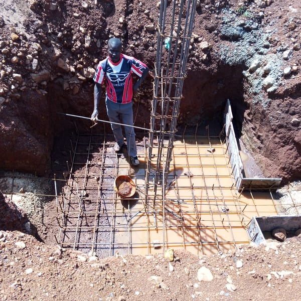Construction workers pour foundations, install rebar in Kenya