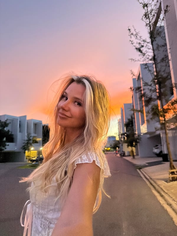 Sunset selfie session on a Thep Krasatti street at dusk