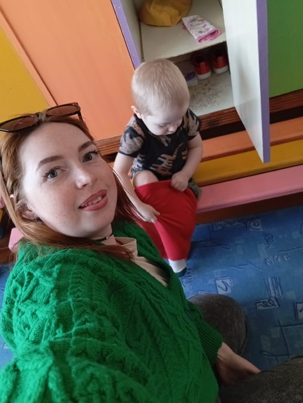 Woman and toddler share playful indoor moments