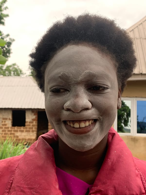Person covered in white dust documented in rural Nigeria