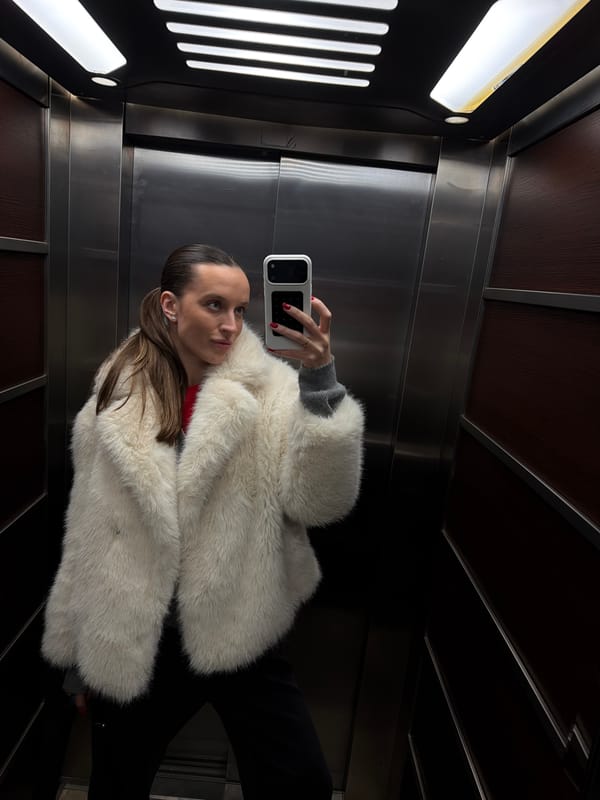 Woman photographed with flowers during evening photo session in Budva