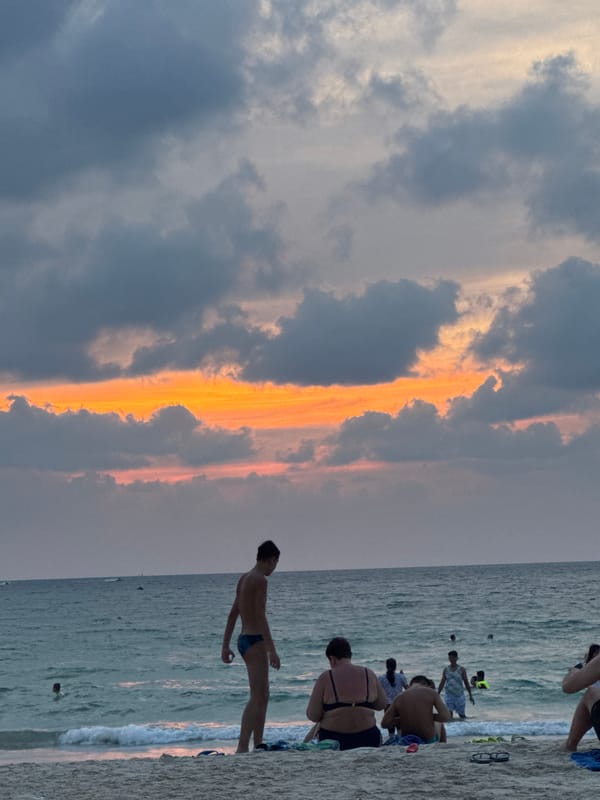 Morning swimmers enjoy hotel pool in Patong, Thailand
