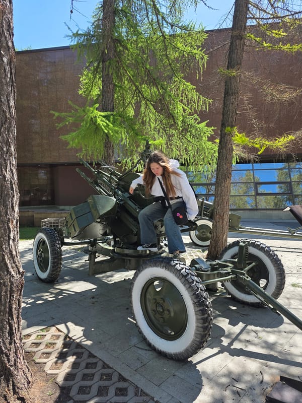 Children play on military memorial artillery in Ufa