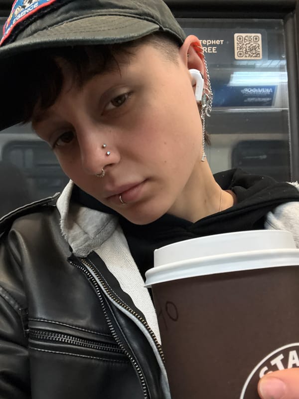 Parent and infant ride Moscow Metro during afternoon commute