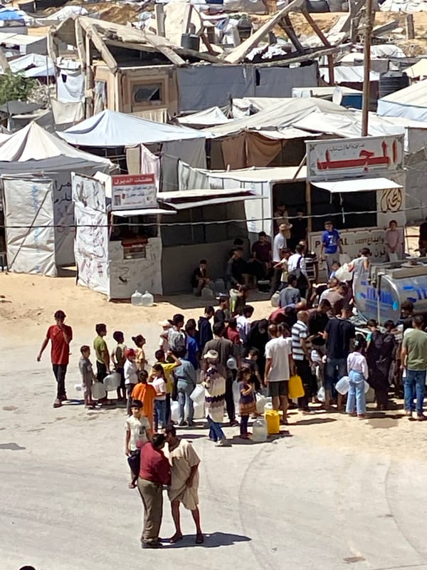 Khan Yunis camp residents line up for water amid crowded makeshift shelters