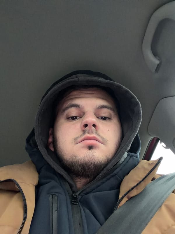 Man takes selfie inside vehicle in Mezdreya, Bulgaria