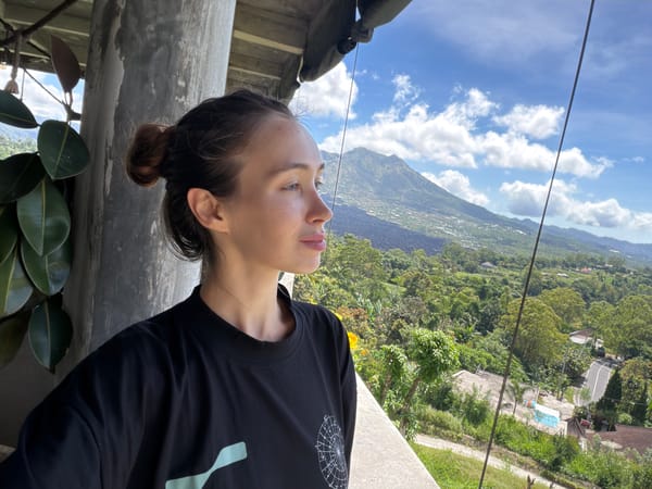 Woman visits mountain-view restaurant terrace in Kintamani, Indonesia