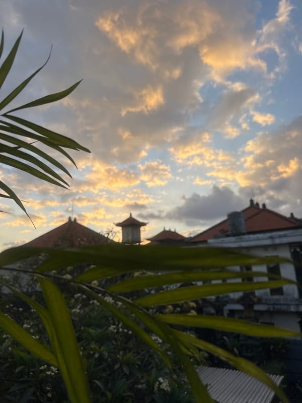 Dramatic sunset captured over Kuta's traditional architecture Monday evening