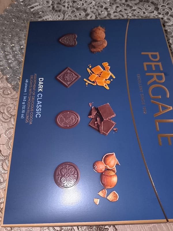 Quiet evening moments with sleeping dog, chocolates captured in Lithuania