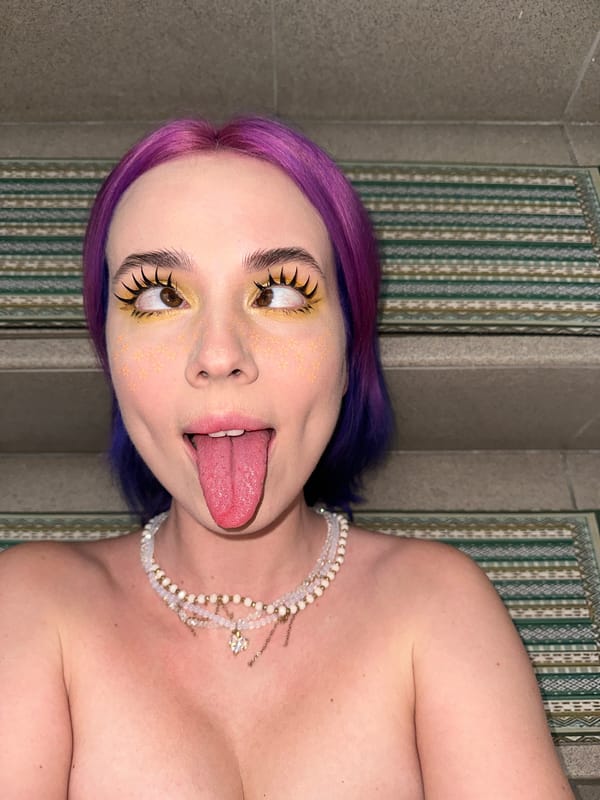 Purple-haired woman conducts elaborate photoshoot on Zagreb building steps