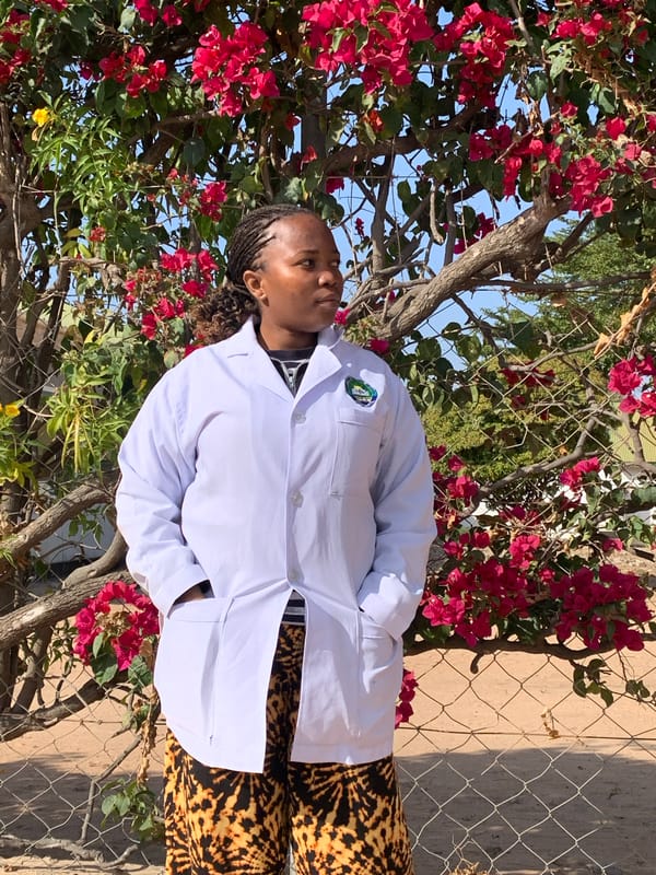 Lab coats and bougainvillea: a morning scene at Dodoma facility