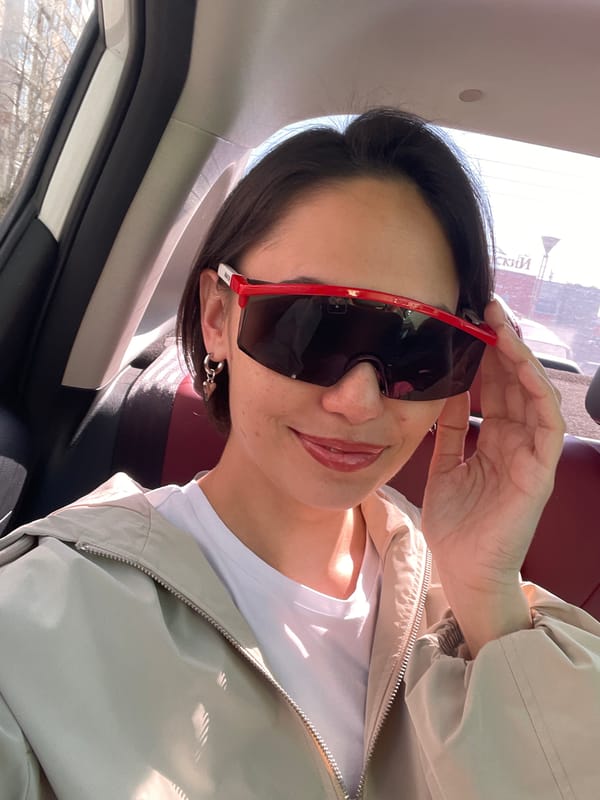 Woman takes car selfies in red sunglasses, Izhevsk