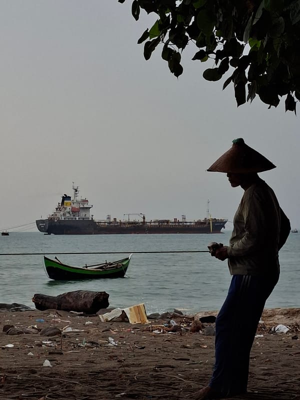 Midnight fishing activity documented on polluted Indonesian beach
