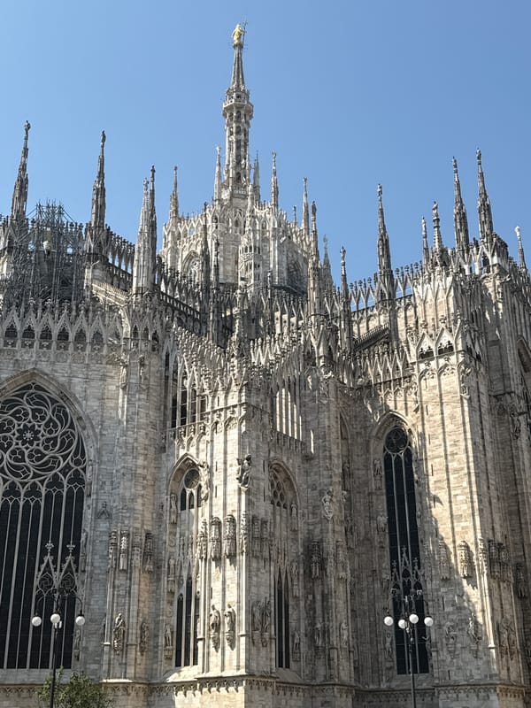 Milan Cathedral's Gothic architecture photographed under clear skies