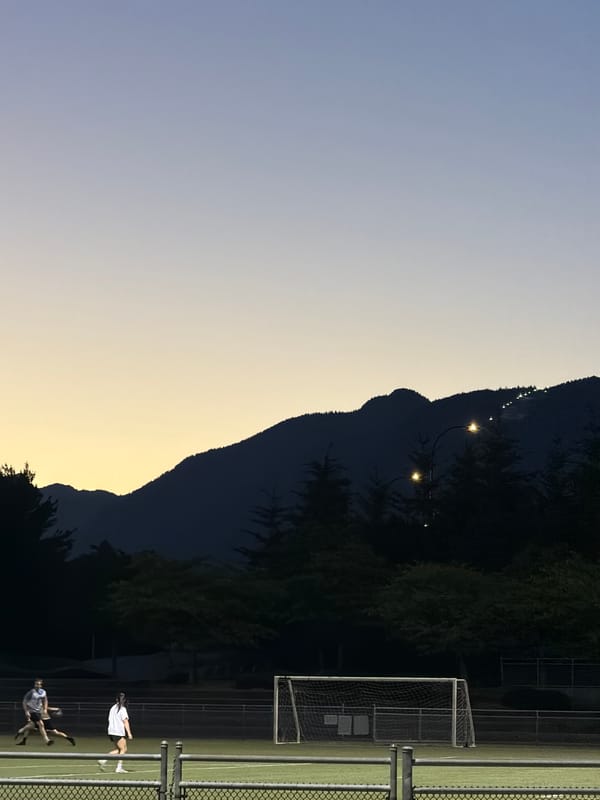 Soccer under the lights near the PNE at dusk