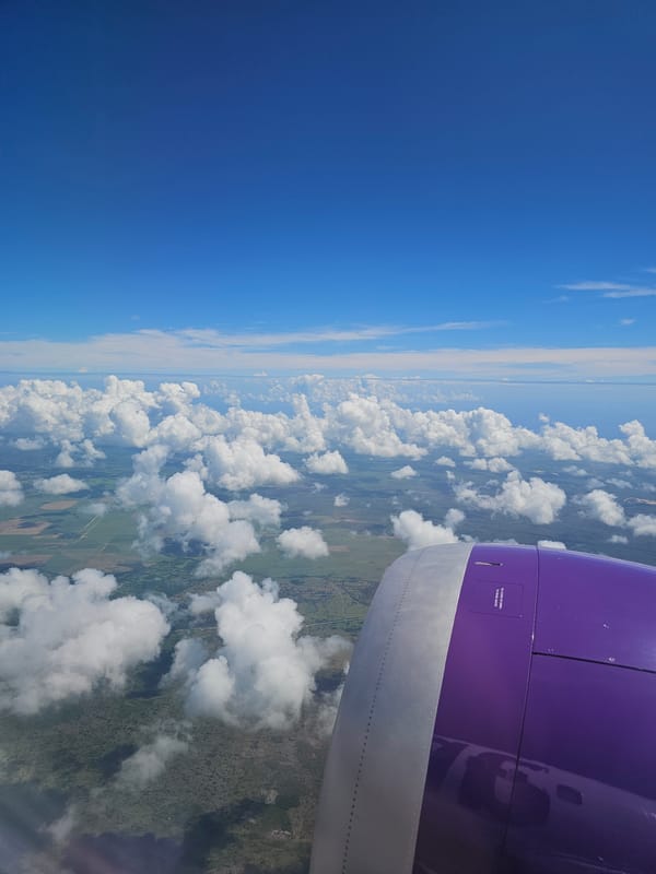 Aircraft window view documented over Dominican Republic