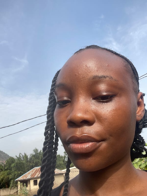 Young woman takes selfies in Lokoja, Nigeria
