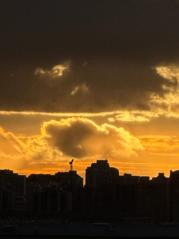 Evening sunset observed over Moscow cityscape with golden skies