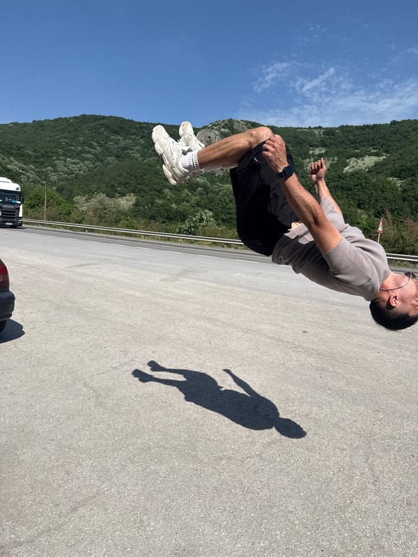 Man performs acrobatic stunts near roadside in Targovishte, Bulgaria