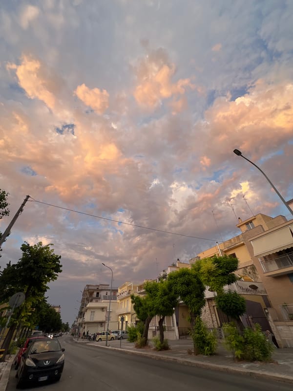 Bitonto streets at golden hour, shops and sky on show