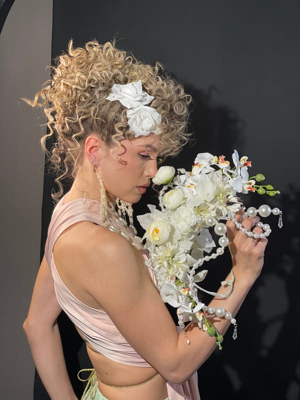 Woman poses for formal portrait with flowers in Russia