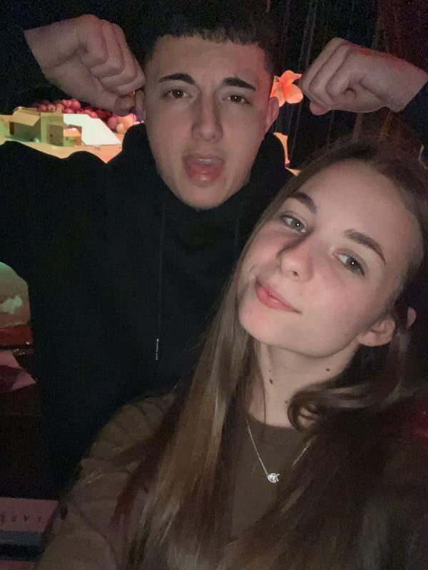 Couple takes selfie near audio setup overlooking performance in Bulgaria