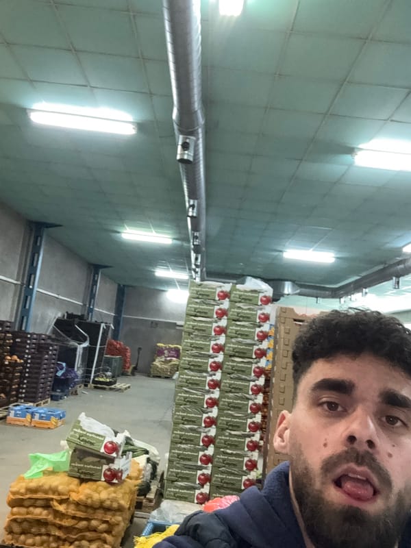 Man photographed with mouth open in warehouse setting