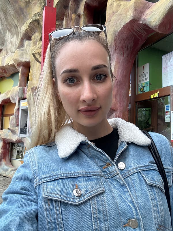 Woman Takes Selfie in Denim Jacket in Tbilisi