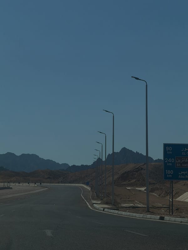Desert highway curves through rocky Sharm El Sheikh landscape