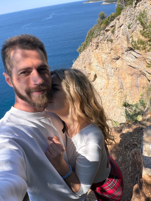 Couple takes selfie on scenic Adriatic cliff in Budva