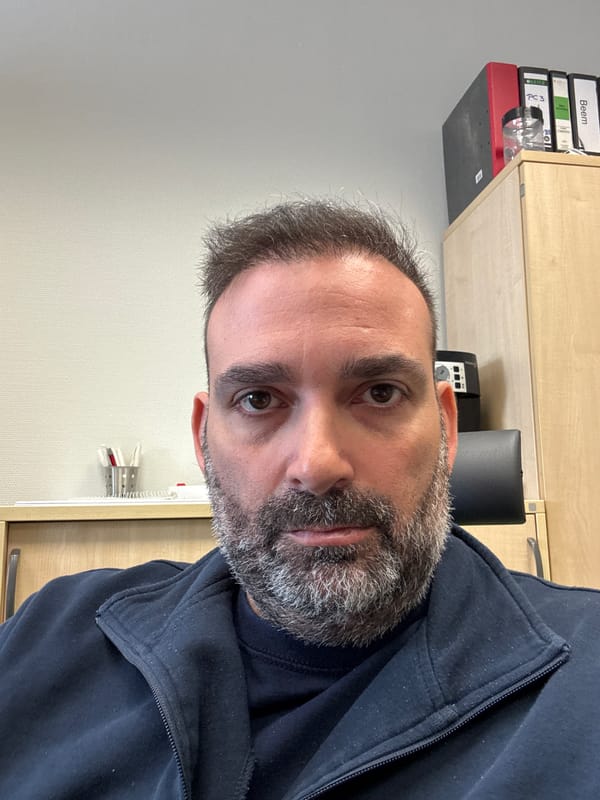 Middle-aged man photographed in office setting in Grevenmacher