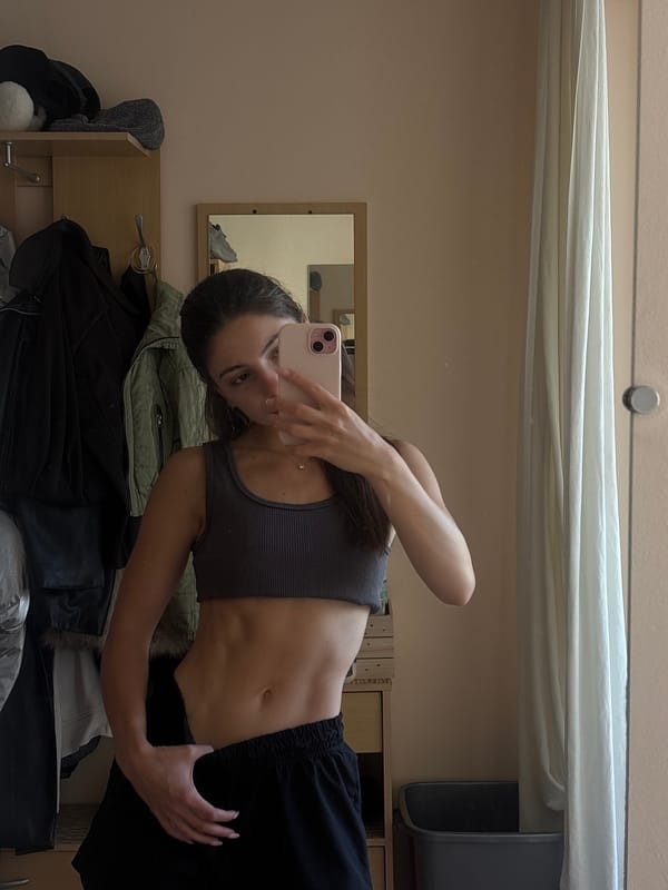Mirror selfie series in a Varna bedroom, athletic wear throughout