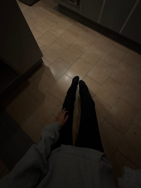 Person sits on kitchen floor in Mexico City home