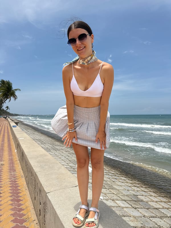 Woman in beachwear photographed on Vietnam seaside promenade