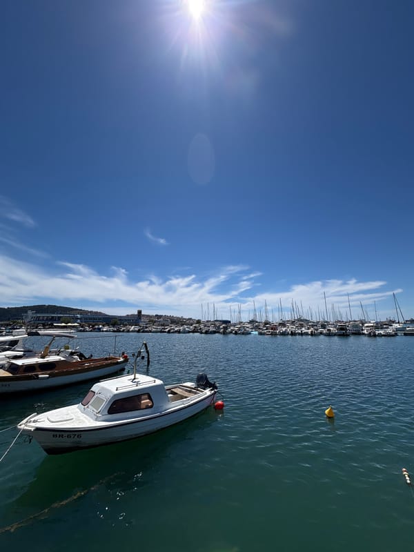 Sunny waterfront walk through Bar, Montenegro's marina and parks
