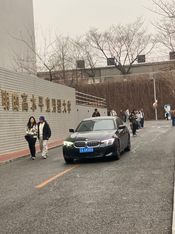 Residents navigate rainy streets with umbrellas in Zhongtun