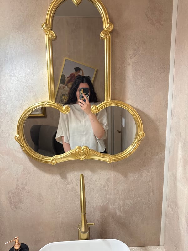 Witnesses document unusual gold mirror design in bathroom interior