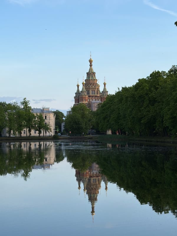 Witness documents peaceful Peterhof landscape and church architecture
