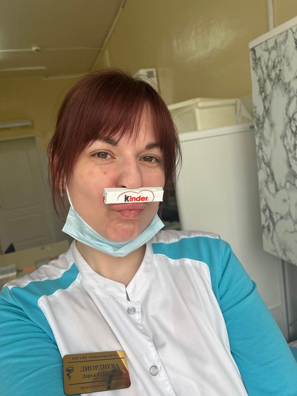 Medical worker balances chocolate bar on nose in Russia