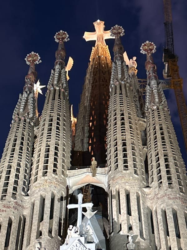 Tourist captures nighttime views of illuminated Sagrada Familia