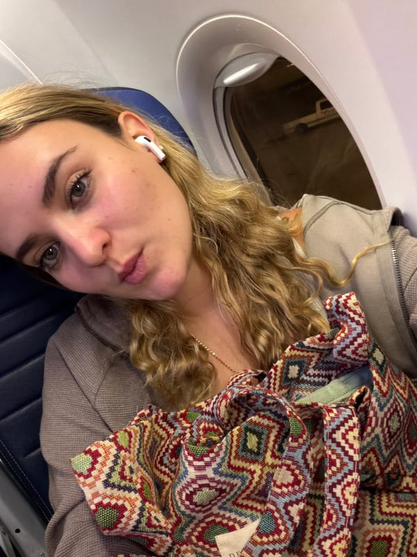Woman takes selfie on plane at Miami International Airport