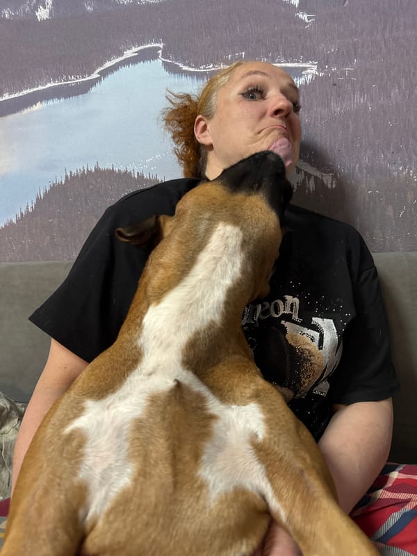 Family dog shares affectionate moments with owners in Chaikovsky