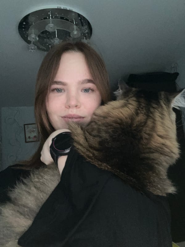 Woman documents afternoon in Chaikovsky with selfies, cat, child