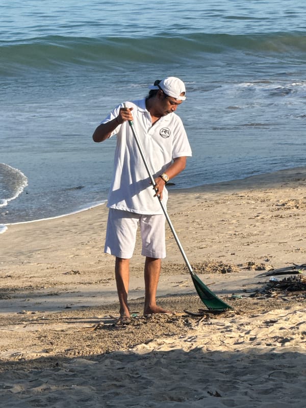 Man conducts beach cleanup in Kuta Selatan, Indonesia