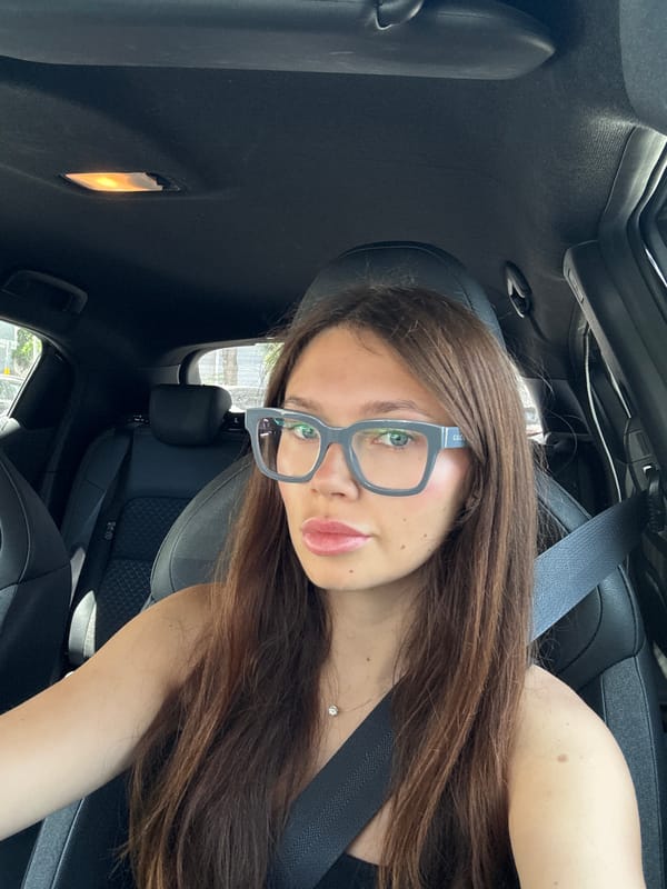 Woman with designer glasses observed in driver's seat in Ramat Gan