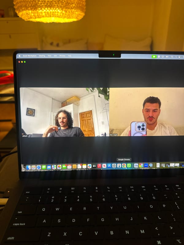 Remote meeting in progress on laptop in Milan