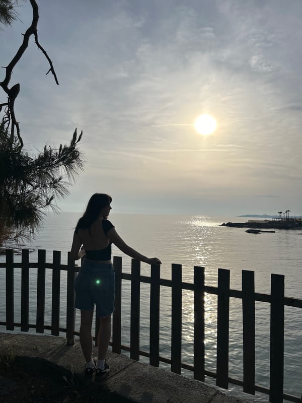 Woman photographs Mediterranean coastline scenes in sunny Alanya