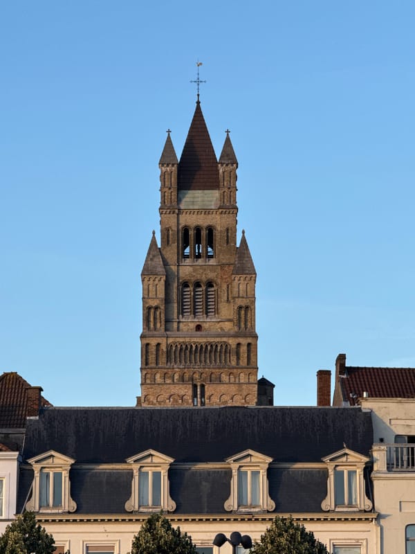 Evening stroll through Bruges landmarks, rooftops, and café terraces