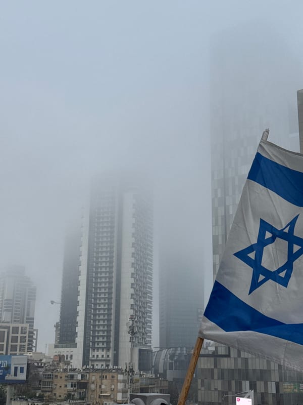 Israeli flag displayed amid foggy Ramat Gan cityscape